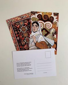 two envelopes with an image of a woman on one and a postcard in the other