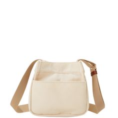 Everyday Classic  With a perfectly petite silhouette and lightweight Italian cotton canvas, this classic look look will carry all of your essentials in style. Canvas Crossbody Bucket Bag For On-the-go, Canvas Bucket Bag Crossbody For On-the-go, Canvas Crossbody Bucket Bag, Canvas Crossbody Bucket Bag For Travel, Beige Crossbody Bucket Bag With Pockets, Canvas Crossbody Bucket Bag With Pockets, Classic Canvas Shoulder Bag With Pockets, Everyday Canvas Lined Crossbody Shoulder Bag, Canvas Lining Crossbody Shoulder Bag