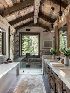 a large bathroom with two sinks and a bathtub