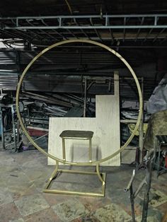 a chair sitting in the middle of a room next to a table and some other items