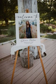 an easel with a welcome sign on it