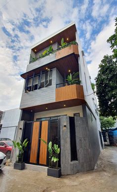 a tall building with plants growing out of it