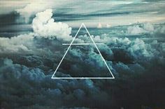 the sky is filled with clouds and there is a triangle in the middle