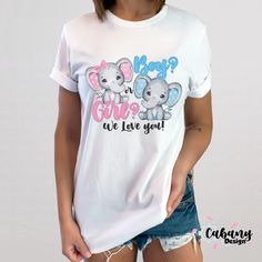 a woman wearing a white t - shirt with two elephants on it and the words who's cute are you?