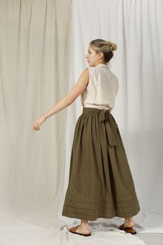 "FOR THIS ITEM, WE NEED YOUR \" WAIST AND HEIGHT \" MEASUREMENTS SO WE CAN TAILOR THE SKIRT TO FIT YOU BEST. HANDMADE ITEAM - perfect French seam - The model is 1m69 tall and wearing size S and Moss Color ■ fit - CAFT LENGTH SKIRT FOR WOMEN - Has belt and two pockets inside ■ Sizing details and color - Please choose sizes carefully as we provided a very detailed sizing guide. - If you're not sure with sizing you can send us your information you want to get help before placing an order. - For complex custom request, we will charge an extra 50% of the item cost. - Please note that actual colors may slightly vary due to your computer resolution and monitor color settings. ■ Care instructions -With washing machine: In washing bag, please choose Cotton/ Linen washing option. Best to hand-wash w Relaxed Fit Lined Wrap Skirt For Daywear, Flowy Long Skirt For Daywear, Voluminous Gathered Green Skirt, Green Voluminous Gathered Skirt, Relaxed Fit Tiered Lined Skirt, Relaxed Midi Wrap Skirt For Daywear, Long Lined Wrap Skirt For Daywear, Daywear Long Lined Wrap Skirt, Spring Flowy Khaki Skirt