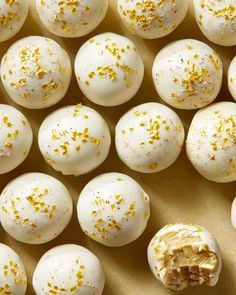 white chocolate covered with gold sprinkles on top of a table