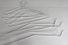 there are many clothes hangers on the wall