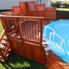 an above ground pool surrounded by wooden decking