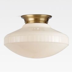 a ceiling light with a white glass shade