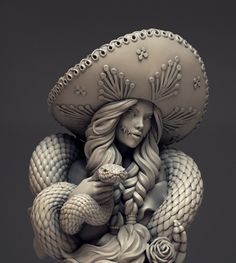 a statue of a woman holding a snake with a hat on it's head