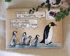 an envelope with penguins on it and a message bubble