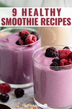 two glasses filled with smoothie and raspberries