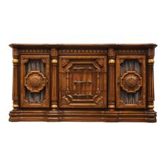 an old fashioned wooden sideboard with carvings on the front and sides, against a white background