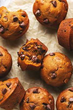 chocolate chip muffins on top of parchment paper