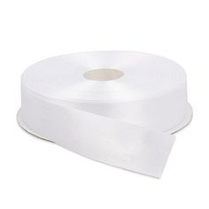 a roll of white satin ribbon on a white background