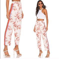 Quisy Cropped Floral & Stripe Pants In Porcelain Trendy Lounge / Have That Trendy Pajama Feel That Is Very Popular Right Now. Can Be Dressed Up Or Down And Very Comfortable Beautiful Floral Pattern All Over With A Almost Rainbow Stripe Down The Sides ( Yellow, Purple, Red, Terra Cotta) Perfect Addition To A Fall Wardrobe Fabric: Crepe Contrast Side Stripes Floral Print Straight-Cut Style Ankle Length Drawstring At Waist Slant Hip Pockets Lined Shell: 100% Viscose Lining: 100% Polyester White Floral Print Trousers, White Floral Print Pants, White Floral Print Straight Pants, White Floral Print Ankle-length Bottoms, White Floral Print Ankle-length Pants, White Printed Ankle-length Bottoms, White Printed Ankle-length Pants, Ankle-length Printed White Pants, White Floral Print Summer Pants