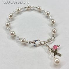 "This lovely Swarovski pearl and crystal bracelet is sure to be the perfect gift. -Bracelet measures 5 ½ inches plus a 1 inch extension chain. -The bracelet includes a pearl & crystal dangle and a cross. This bracelet has been a big seller for First Communion, Confirmation, Easter, Flower Girls, Maid-of-Honor, Bridesmaids, Mother-of-the-Bride, Godmothers, and Brides. Please see other listing for adult size. Necklace is a perfect match. -Necklace measures 13 ¾\" and has a 1\" extension chain. Nickel-free White Jewelry For Birthday Gift, Adjustable Silver Pearl Bracelet For Valentine's Day, Elegant Personalized Jewelry For Special Day, White Jewelry For Birthday Gift On Mother's Day, White Jewelry For Mother's Day Birthday Gift, White Jewelry Birthday Gift, Elegant Personalized Adjustable Rosary Bracelet, White Pearl Bracelet For Wedding And Valentine's Day, Adjustable Pearl Charm Jewelry As Gift