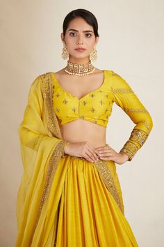 Yellow attached can can lehenga with floral embroidery in bead, cutdana and sitara. Paired with embroidered, padded blouse and embroidered border dupatta.
Components: 3
Pattern: Embroidered
Type Of Work: Bead, Cutdana, Sitara
Neckline: Leaf
Sleeve Type: Long
Fabric: Chanderi
Color: Yellow
Other Details: 
Floral pattern
Back tie-up
Lehenga Length: 44 inches
Occasion: Bride,Wedding - Aza Fashions Astha Narang, Leaf Sleeve, Embroidered Lehenga, Beaded Leaf, Embroidered Border, Can Can, Set For Women, Aza Fashion, Floral Embroidery