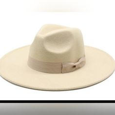 Wide Brim Hat With Small Bow Cream Fedora Hat One Size Fits Most, Elegant Winter Vacation Hats, Cream Brimmed Fedora One Size Fits Most, Classic Cream Felt Hat For Beach, Chic Cream Adjustable Hat, Chic Adjustable Beige Hat, Adjustable Cream Fedora For Winter, Cream Adjustable Fedora For Winter, Trendy Cream Fedora Sun Hat