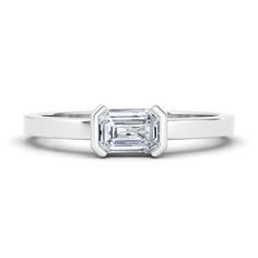 Our favorite way to rock our values is with an emerald cut diamond and a setting as unique as a half-bezel! Bezel Wedding Set, Bezel Diamond Ring, Bezel Diamond Rings, Half Bezel, Stackable Wedding Bands, Our Values, Emerald Cut Diamond, Diamond Settings, Unisex Ring