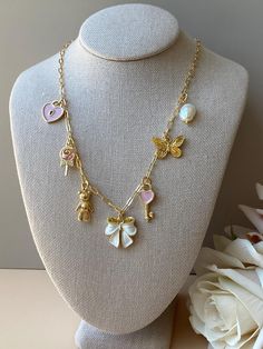 Please Read   Photos are enlarged to show detail. Please read the measurement in the description.  DETAILS:  ☑️ The chain is 14kt heavy Gold plated. ☑️ The charms are heavy gold plated. ♥️ Follow us and like us on Instagram for discount codes and new designs @mathewandmarieco Coquette Necklace, Pink Lollipop, Bow Coquette, Pink Charm, White Bow, Discount Codes, Lollipop, Pink And White, Halloween Shopping