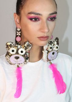 Champagne colored sequin bear chandelier earrings with pink bead, feather and jeweled accents. One of a kind. Hand crafted in Mykonos by Pericles Kondylatos. Immediate shipping from New York, NY. Festive Pink Chandelier Earrings For Festivals, Artsy Pink Festival Jewelry, Pink Festival Earrings With Colorful Beads, Bear Chandelier, Vibrant Pink Earrings For Festivals, Pink Novelty Jewelry With Colorful Beads, Sequin Earrings, Bear Earrings, Oversized Earrings