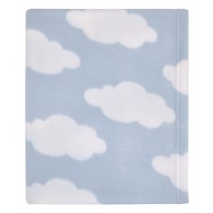 a blue blanket with white clouds on it