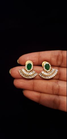 "These earrings are designed with CZ and semi precious ruby/ emerald stones. Its an absolute Fashion Jewelry Earrings set have an excellent finish and gives out an exquisite sense of style. If you are looking for an amazing Fashion Jewelry set for special occasions such as Anniversary, Engagement, Party, Wedding or for gifting, then your search ends here. Handmade Indian, best to wear it for any occasion, traditional ceremonies or Indian wedding. This boutique jewelry has ethnic finish. It has C Elegant Green Earrings With Stones, Elegant Green Crystal Earrings For Festive Occasions, Hand Set Emerald Earrings For Party, Green Gemstone Earrings For Party, Green Cubic Zirconia Earrings For Celebration, Elegant Green Stone Work Earrings, Elegant Green Earrings With Stone Work, Green Gemstone Earrings For Celebration, Green Jeweled Earrings For Celebration