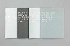 three brochures with white and grey designs on them