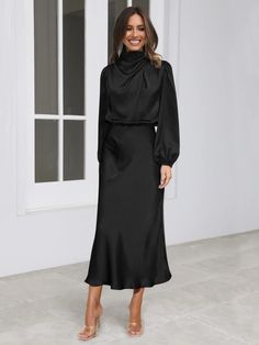 Make a statement in this FROM THE SOURCE High Neck Bridal Maxi Dress in Black! This stunning satin dress will make waves as you walk down the aisle and beyond. Dare to be bold and defy expectations with this daring wedding guest style dress. Stand out! Size Guide: Model is 5’7” tall, and has a 33.4” bust, 26.5” waist, & 34.6” hips. She is wearing a S / US 4 / AU 8. This dress is true to size. Material: 100% Polyester. Feature: High Neckline. Long Sleeve. Flowery Skirt. Elastic Waist. Maxi Length. Care Instructions: Machine wash / Cold hand wash Satin Long Sleeve Dress, Bridal Maxi Dress, Long Sleeve Satin Dress, Socialite Style, Party Midi Dress, Hip Skirt, Satin Long Sleeve, Elegant Maxi Dress, Long Sleeve Evening Dresses