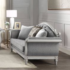 Embark on a journey where the art of relaxation meets the allure of refined living with the Florian Loveseat. Immerse yourself in the perfect union of supreme comfort and timeless elegance as you recline on this exquisite piece of furniture. The loveseat is gracefully adorned with stylish gray fabric upholstery, creating an inviting texture that beckons you to sink into its luxurious embrace. Accentuating its visual appeal is the antique white finish, meticulously applied to enhance the loveseat Sofa Gray, Blanket Black, Acme Furniture, White Sofas, Gray Sofa, Living Room Furniture Sofas, Gray Fabric, Fabric Upholstery, Living Room Seating