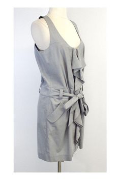 Size 12 Grey Sleeveless Dress Body 69% Wool 29% Polyester 2% Lycra Exposed front zip Ruffly detail Scoop neck Waist tie Hip pockets Underarm to underarm 18.75" Waist 35" Hips 43" Total length 36.5" Sleeveless Dress With Side Zipper For Spring, Sleeveless Dresses With Side Zipper For Spring, Sleeveless Workwear Dress With Side Zipper, Sleeveless Work Dresses With Side Zipper, Ruffled Sleeveless Dress For Workwear, Spring Sleeveless Dress With Back Zipper For Work, Spring Workwear Dresses With Side Zipper, Sleeveless Dress With Back Zipper For Daywear, Fitted Sleeveless Dress With Ruffles For Work