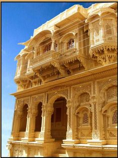 an ornate building with balconies and windows