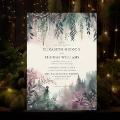 a wedding card with an image of a fairy in the woods and lights behind it