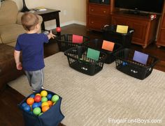 a young boy standing in front of a tv