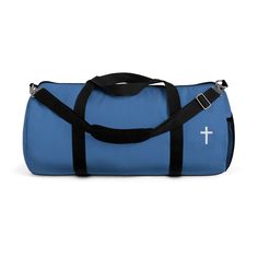 a blue duffel bag with black straps