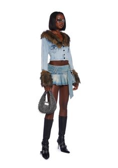 This jacket has a denim construction with a faux fur notched lapel collar, faux fur cuffs, chest pockets with button closures, and front button closures. Denim Jacket With Faux Fur Lining For Fall, Trendy Spring Denim Jacket With Faux Fur Lining, Collared Denim Blue Jacket For Winter, Chic Winter Medium Wash Denim Jacket, Casual Fur Coat With Faux Fur Trim For Spring, Trendy Denim Jacket With Faux Fur Trim For Fall, Chic Denim Jacket With Pockets For Winter, Casual Fitted Fur Coat With Faux Fur Lining, Chic Medium Wash Winter Outerwear