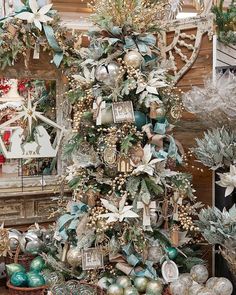 a christmas tree decorated with ornaments and greenery