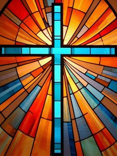 a stained glass window with a cross on it