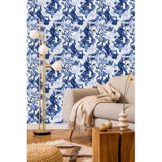 a living room with blue and white wallpaper