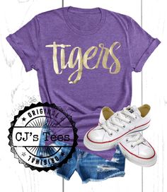 Soft comfy t-shirt and tank with gold foil vinyl lettering. Perfect for LSU events! T-Shirts are unisex fit and true to size. Tanks are fitted and true to size. Size up for looser fit. Gold T-shirt With Letter Print For Summer, Summer Graphic Tee With Team Name, Trendy Gold T-shirt For Summer, Trendy Gold Summer T-shirt, Spring Gold Graphic Print T-shirt, Gold Letter Print Top For Summer, Gold Letter Print Tops For Summer, Summer Team Spirit T-shirt, Gold Crew Neck T-shirt With Letter Print