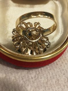 This 18K yellow gold ring is from northwest Indiana. I'm the third owner. The original owner sold it to a dealer, who called me to look at this awesome ring. Of course, I ended up buying it. It's 6.6 or 6.7 grams of 18k gold, and is stamped inside the ring. (My gram scale keeps fluctuating back and forth). There are 9 round genuine sapphires that are a medium blue. They aren't the dark, inky looking stones. They are roughly 3 mm each, but they are all slightly different. I'll call it roughly a c Collectible 14k Gold Diamond Ring, Heirloom Gold Marquise Cut Emerald Ring, Heirloom Marquise Cut Gold Emerald Ring, Collectible Cluster Ring With Brilliant Cut, Fine Jewelry Yellow Gold Emerald Ring For Collectors, Heirloom 14k Stamped Opal Ring For Formal Occasions, Victorian Style Round Emerald Ring In Yellow Gold, Heirloom Opal Ring Stamped 14k For Formal Occasions, Collectible Fine Jewelry Round Sapphire Ring