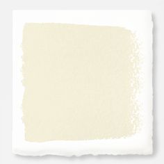 a white paint swatch on a gray background