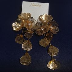 Natasha Flower Drop Earrings In Gold Tone 4.5” Nwt Natasha Gold Tone Flower Keep Jewelry Away From Water And Chemicals Remove During Physical Activities Store Separately In A Soft Pouch. Gold Tone Lead Compliant Imported Drop, 4.5” Width, 2.2” Light To Medium Weight Gold Jewelry With Flower Decoration For Parties, Party Jewelry With Gold Flower Decoration, Gold Flower-shaped Elegant Chandelier Earrings, Gold Flower Chandelier Earrings Elegant Style, Elegant Gold Flower Chandelier Earrings, Elegant Bridal Earrings With Handmade Gold Flowers, Elegant Gold Bridal Earrings With Handmade Flowers, Gold Flower Earrings With Handmade Details For Party, Gold Bridal Drop Earrings With Flower Decoration