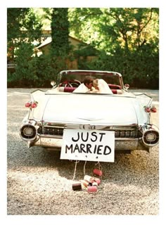 a wedding car with a just married sign attached to it