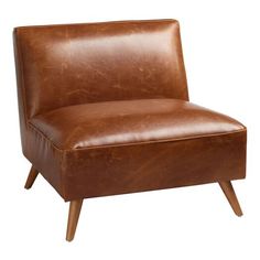 a brown leather chair with wooden legs