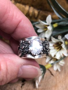 This ring is created with Fine Silver and enhanced with a Cubic Zirconia stone.  It features a carnation flower with the stem and leaves on either side of the stone.  Size 7 & 1/2 Carnation Flower, Silver Bars, Stunning Necklace, Silver Leaf, Fine Silver, Statement Ring, Rings Statement, Statement Rings, Cubic Zirconia