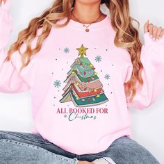 All Booked For Christmas Sweatshirt, Bookworm Christmas Sweater, Christmas Book Tree Sweatshirt, Book Lovers Christmas,Holiday Teacher Gifts A kind present for a friend, member of the family, a loved one, or a treat just for you. Keep them dear to your heart and wear your love. This affordable and caring gift will be cherished by your loved one without a doub. - HOW TO ORDER? - 1. Select the options that you want from the dropdown menu. 2. Add to cart and proceed to checkout. 3. Don't forget to submit your personalization. - PROCESSING TIME - We are so excited to offer to you expedited processing on all our orders, which may take anywhere from 1 - 2 business days. - NEXT DAY SHIPPING - Please be aware that the "ship date" DOES NOT mean the actual "delivery date." SHIPPING DATE: When your p Holiday Teacher Gifts, Teacher Holiday Gifts, Book Tree, Christmas Book, Sweater Christmas, Christmas Books, Dallas Tx, Kids Sweatshirt