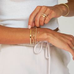 Every bracelet stack needs a solid gold option to add texture and that signature bold gold shine. We love the Melody Eden Gold Bar Bracelet for delivering on the substantial gold look with a lightweight feel and attainable price point. The stations are comprised of high-shine 14k karat gold and are hollow, so they never feel heavy, and the semi-fixed design means this station bracelet wears like your favorite cuff. With an adjustable length, this gold bracelet has everything you need for your gr Gold Bar Bracelet, Dana Rebecca Designs, Station Bracelet, The Melody, Bar Bracelet, Blog Branding, Bar Bracelets, Gold Bar, Bracelet Collection