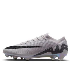 the nike vapor soccer shoe is shown in white and black, with silver accents on the upper